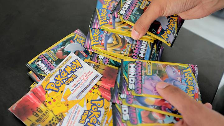 Brandon Santiago, co-owner of The Kard Shop, goes through the recent tickets that were cashed in for a pack of Pokemon cards Brandon Santiago, co-owner of The Kard Shop, goes through the recent tickets that were cashed in for a pack of Pokemon cards