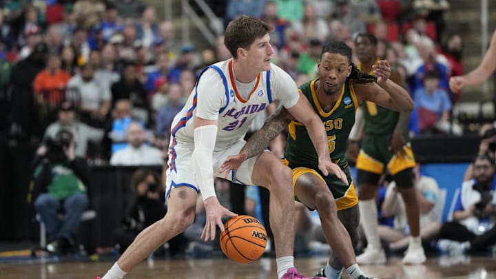 Mar 21, 2025; Raleigh, NC, USA;  Norfolk State Spartans guard Brian Moore Jr. (5) defends against Florida Gators forward Alex Condon (21) during the second half at Lenovo Center. Mandatory Credit: Bob Donnan-Imagn Images
