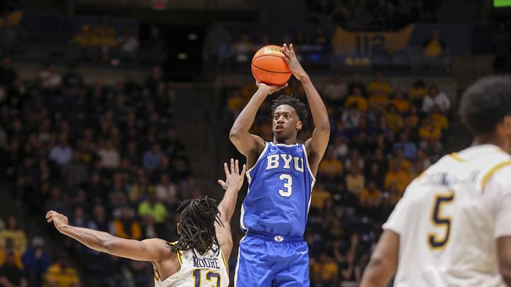 Feb 28, 2026; Morgantown, West Virginia, USA; BYU Cougars forward AJ Dybantsa (3) shoots a three point shot over West Virginia Mountaineers guard Chance Moore (13) during the first half at Hope Coliseum. Mandatory Credit: Ben Queen-Imagn Images Feb 28, 2026; Morgantown, West Virginia, USA; BYU Cougars forward AJ Dybantsa (3) shoots a three point shot over West Virginia Mountaineers guard Chance Moore (13) during the first half at Hope Coliseum. Mandatory Credit: Ben Queen-Imagn Images