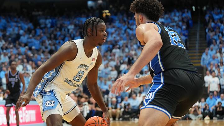 Feb 7, 2026; Chapel Hill, North Carolina, USA; North Carolina Tar Heels forward Caleb Wilson (8) with the ball as Duke Blue Devils forward Cameron Boozer (12) defends in the second half at Dean E. Smith Center. Mandatory Credit: Bob Donnan-Imagn Images