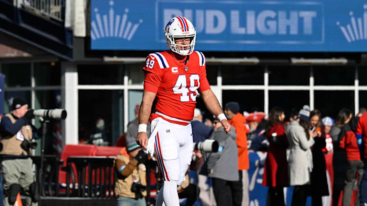 Dec 1, 2024; Foxborough, Massachusetts, USA; New England Patriots long snapper Joe Cardona (49) warms up before a game against the Indianapolis Colts at Gillette Stadium. Mandatory Credit: Eric Canha-Imagn Images