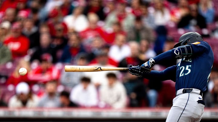 Seattle Mariners second baseman Dylan Moore (25) hits a double in the second inning of the MLB game between Cincinnati Reds and Seattle Mariners at Great American Ball Park in Cincinnati on Wednesday, April 16, 2025. Seattle Mariners second baseman Dylan Moore (25) hits a double in the second inning of the MLB game between Cincinnati Reds and Seattle Mariners at Great American Ball Park in Cincinnati on Wednesday, April 16, 2025.