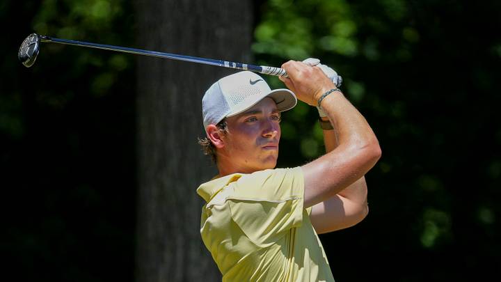 Ben James watches his tee shot on number two during the final round of the Wyndham Championship; Jim Dedmon