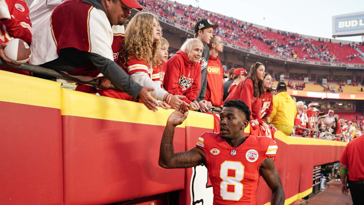 Oct 12, 2023; Kansas City, Missouri, USA; Kansas City Chiefs wide receiver Justyn Ross (8) celebrates with fans while leaving the game after the win over the Los Angeles Chargers at GEHA Field at Arrowhead Stadium. Mandatory Credit: Denny Medley-Imagn Images