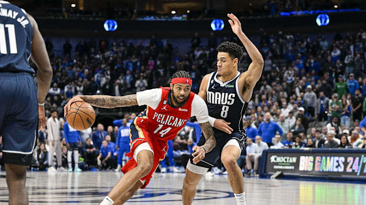 Feb 2, 2023; Dallas, Texas, USA; New Orleans Pelicans forward Brandon Ingram (14) and Dallas Mavericks guard Josh Green (8) in action during the game between the Dallas Mavericks and the New Orleans Pelicans at American Airlines Center. Mandatory Credit: Jerome Miron-Imagn Images