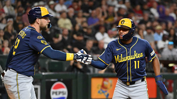 Jackson Chourio and Rhys Hoskins celebrate a Milwaukee Brewers victory in 2025.