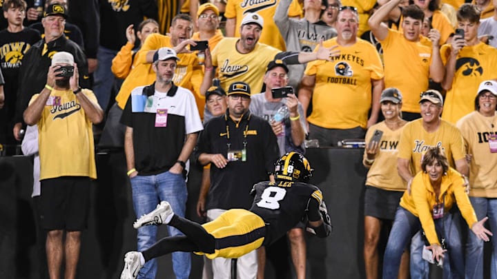 Oct 18, 2025; Iowa City, Iowa, USA; Iowa Hawkeyes defensive back Deshaun Lee (8) intercepts a pass against the Penn State Nittany Lions during the second quarter at Kinnick Stadium. Mandatory Credit: Jeffrey Becker-Imagn Images