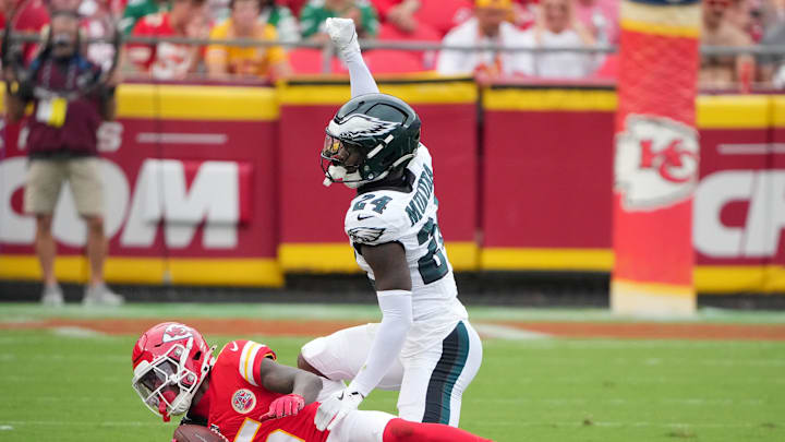 Sep 14, 2025; Kansas City, Missouri, USA; Philadelphia Eagles safety Andrew Mukuba (24) tackles Kansas City Chiefs wide receiver Hollywood Brown (5) during the third quarter of the game at GEHA Field at Arrowhead Stadium. Mandatory Credit: Denny Medley-Imagn Images