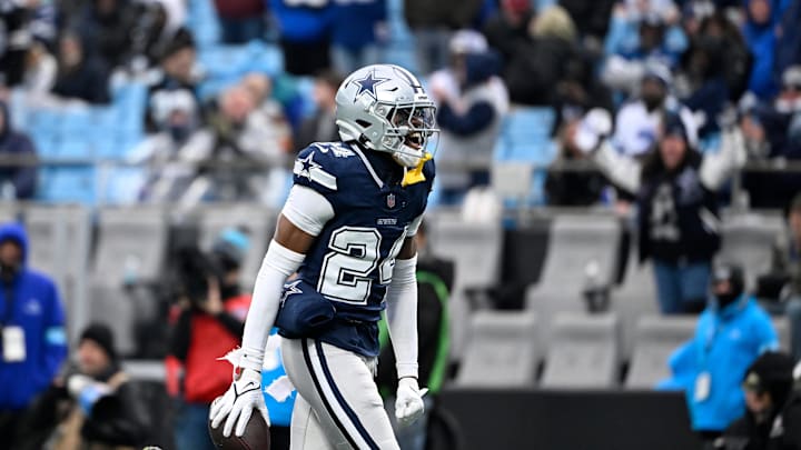 Dec 15, 2024; Charlotte, North Carolina, USA; Dallas Cowboys safety Israel Mukuamu (24) reacts after intercepting the ball in the fourth quarter at Bank of America Stadium. Mandatory Credit: Bob Donnan-Imagn Images