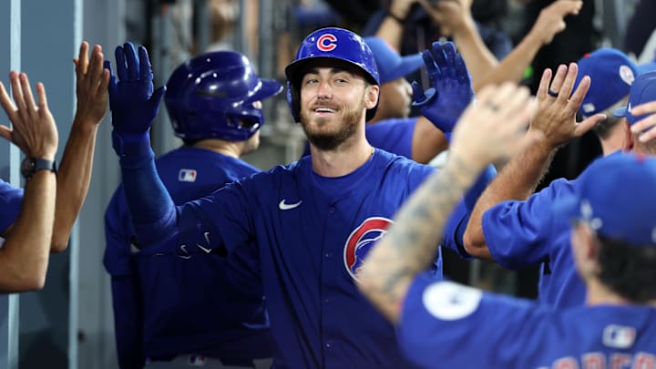 Sep 11, 2024; Los Angeles, California, USA;  Chicago Cubs right fielder Cody Bellinger (24) is greeted in the dugout after hitting a 3-run home run during the fifth inning against the Los Angeles Dodgers at Dodger Stadium. Mandatory Credit: Kiyoshi Mio-Imagn Images