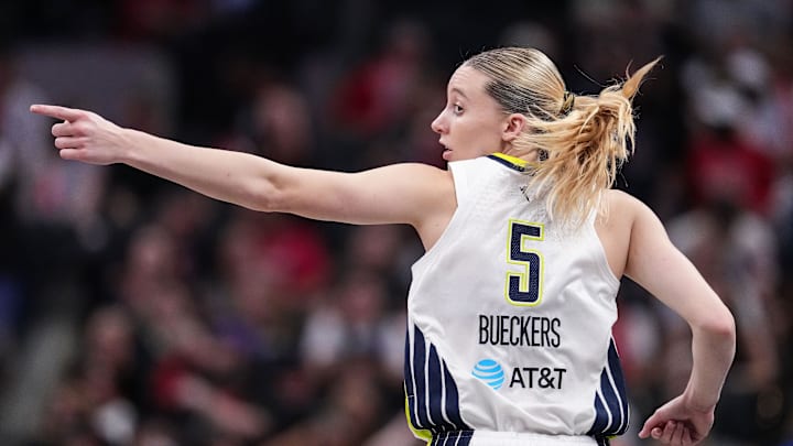 Dallas Wings guard Paige Bueckers (5) points up the court Tuesday, Aug. 12, 2025, during the game at Gainbridge Fieldhouse in Indianapolis. The Dallas Wings defeated the Indiana Fever, 81-80.