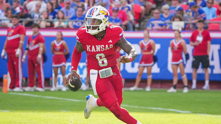 Sep 28, 2024; Kansas City, Missouri, USA; Kansas Jayhawks quarterback Jalon Daniels (6) scrambles in the backfield against the TCU Horned Frogs during the second half at GEHA Field at Arrowhead Stadium. Sep 28, 2024; Kansas City, Missouri, USA; Kansas Jayhawks quarterback Jalon Daniels (6) scrambles in the backfield against the TCU Horned Frogs during the second half at GEHA Field at Arrowhead Stadium.