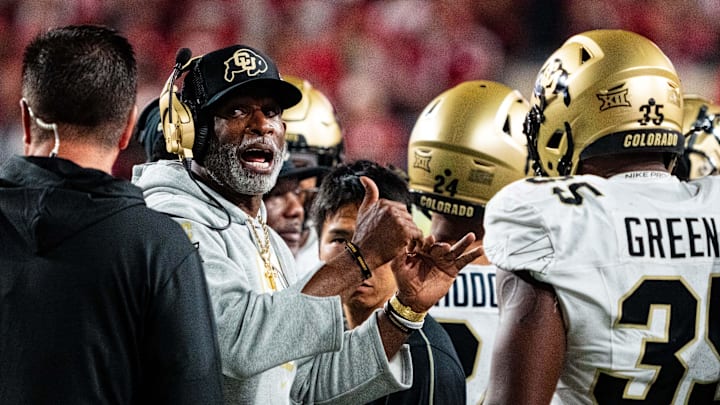 Sep 7, 2024; Lincoln, Nebraska, USA; Colorado Buffaloes head coach Deion Sanders talks with players during a timeout in the third quarter against the Nebraska Cornhuskers at Memorial Stadium. Mandatory Credit: Dylan Widger-Imagn Images