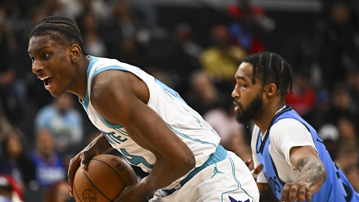 Mar 16, 2025; Inglewood, California, USA; LA Clippers forward Derrick Jones Jr. (55) defends against Charlotte Hornets forward Moussa Diabate (14) during the first half at Intuit Dome. Mandatory Credit: Jonathan Hui-Imagn Images