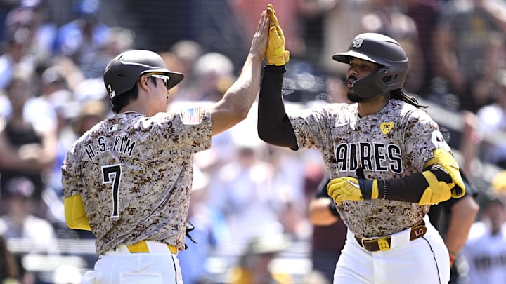 Jul 14, 2024; San Diego, California, USA; San Diego Padres pinch-hitter Luis Campusano (12) is congratulated by shortstop Ha-Seong Kim (7) after hitting a two-run home run against the Atlanta Braves during the seventh inning at Petco Park. Mandatory Credit: Orlando Ramirez-Imagn Images