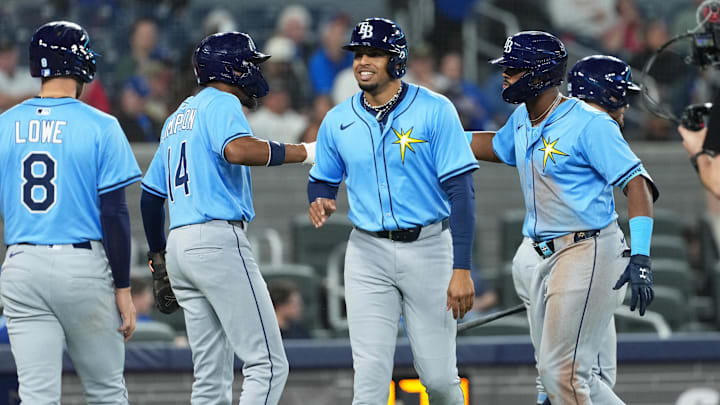 Tampa Bay Rays third baseman Junior Caminero (center) hits a grand slam and celebrates teammates on Tuesday night in Toronto. Tampa Bay Rays third baseman Junior Caminero (center) hits a grand slam and celebrates teammates on Tuesday night in Toronto.