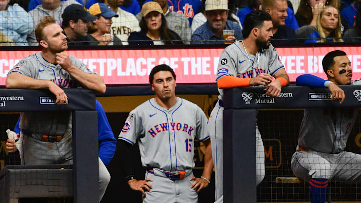 Sep 28, 2024; Milwaukee, Wisconsin, USA; New York Mets first baseman Pete Alonso (20), right fielder Tyrone Taylor (15), second baseman Eddy Alvarez (26) and third baseman Mark Vientos (27) watch in the eighth inning against the Milwaukee Brewers at American Family Field. Mandatory Credit: Benny Sieu-Imagn Images
