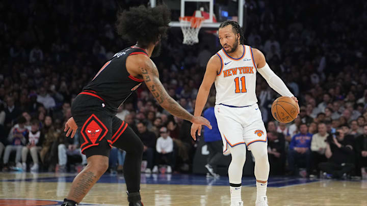 Feb 20, 2025; New York, New York, USA; New York Knicks point guard Jalen Brunson (11) dribbles the ball against Chicago Bulls point guard Coby White (0) during the second half at Madison Square Garden. Mandatory Credit: Gregory Fisher-Imagn Images
