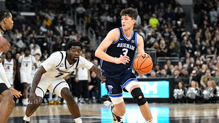 Dec 3, 2024; Providence, Rhode Island, USA; Brigham Young Cougars guard Egor Demin (3) dribbles against Providence Friars guard Bensley Joseph (7) during the second half at Amica Mutual Pavilion. Mandatory Credit: Eric Canha-Imagn Images