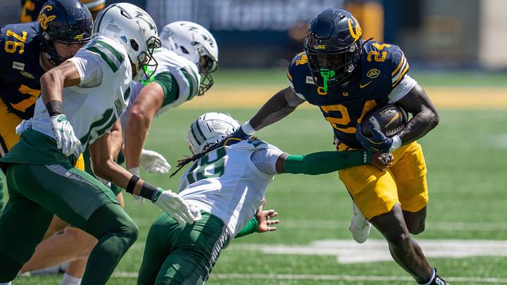 Adam Mohammed (24) runs for a first down against Wagner. Adam Mohammed (24) runs for a first down against Wagner.