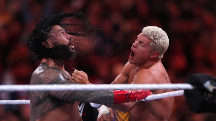 Apr 2, 2023; Inglewood, CA, USA; Cody Rhodes (navy blue pants) and Roman Reigns (black pants) during