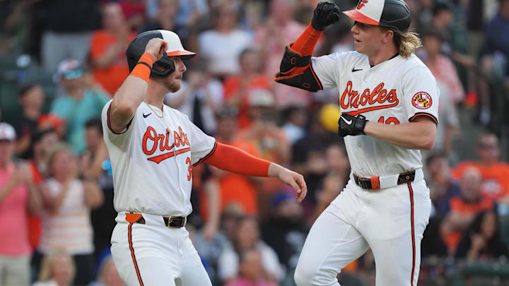 Jun 27, 2024; Baltimore, Maryland, USA; Baltimore Orioles outfielder Heston Kjerstad (13) greeted by designated hitter Ryan O’Hearn (32) following his two-run home run in the third inning against the Texas Rangers at Oriole Park at Camden Yards. Mandatory Credit: Mitch Stringer-Imagn Images