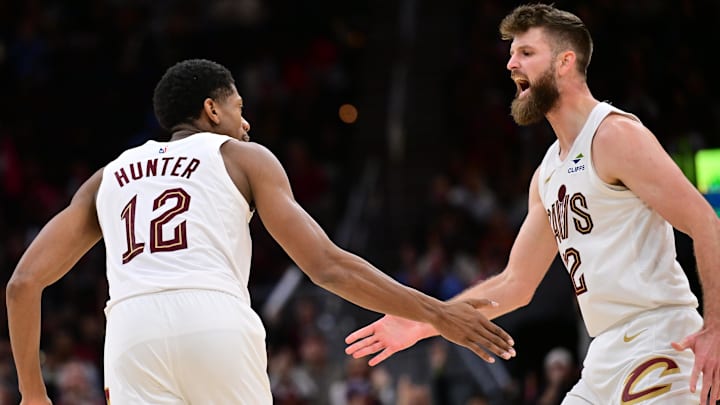 Nov 2, 2025; Cleveland, Ohio, USA; Cleveland Cavaliers forward De'Andre Hunter (12) celebrates with forward Dean Wade (32) during the second half against the Atlanta Hawks at Rocket Arena. Mandatory Credit: Ken Blaze-Imagn Images