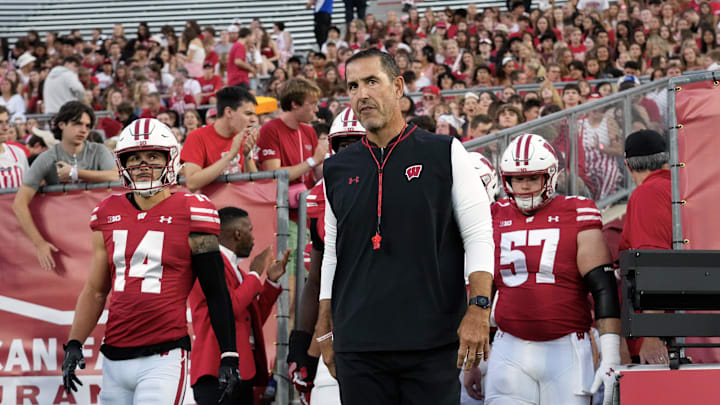 Aug 28, 2025; Madison, Wisconsin, USA; Wisconsin Badgers head coach Luke Fickell walks onto the field for warmups prior to the game against the Miami (OH) RedHawks at Camp Randall Stadium. Mandatory Credit: Jeff Hanisch-Imagn Images Aug 28, 2025; Madison, Wisconsin, USA; Wisconsin Badgers head coach Luke Fickell walks onto the field for warmups prior to the game against the Miami (OH) RedHawks at Camp Randall Stadium. Mandatory Credit: Jeff Hanisch-Imagn Images