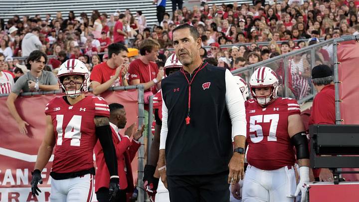 Aug 28, 2025; Madison, Wisconsin, USA;  Wisconsin Badgers head coach Luke Fickell walks onto the field for warmups prior to the game against the Miami (OH) RedHawks at Camp Randall Stadium. Mandatory Credit: Jeff Hanisch-Imagn Images