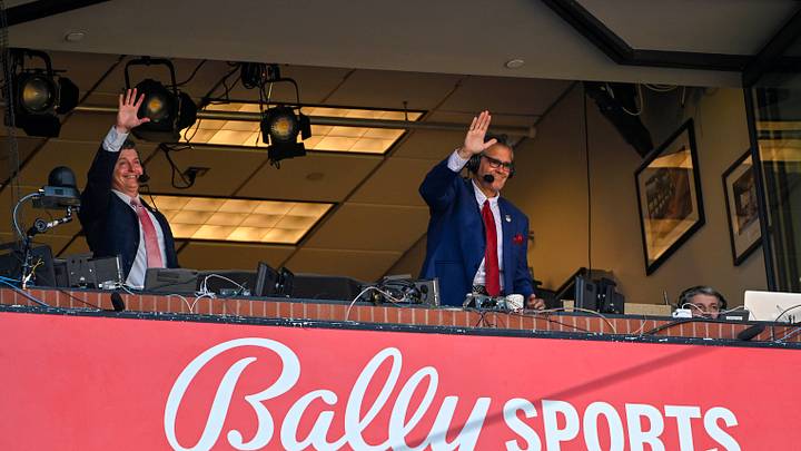 Mar 30, 2023; St. Louis, Missouri, USA; Bally Sports Midwest announcer Chip Caray and Brad Thompson wave to the fans during the second inning of an opening day game between the St. Louis Cardinals and the Toronto Blue Jays at Busch Stadium. Mandatory Credit: Jeff Curry-USA TODAY Sports Mar 30, 2023; St. Louis, Missouri, USA; Bally Sports Midwest announcer Chip Caray and Brad Thompson wave to the fans during the second inning of an opening day game between the St. Louis Cardinals and the Toronto Blue Jays at Busch Stadium. Mandatory Credit: Jeff Curry-USA TODAY Sports