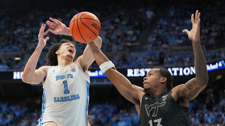 Feb 28, 2026; Chapel Hill, N.C.; North Carolina forward Zayden High (1) is fouled by Virginia Tech forward Amani Hansberry (13) in the second half. Feb 28, 2026; Chapel Hill, N.C.; North Carolina forward Zayden High (1) is fouled by Virginia Tech forward Amani Hansberry (13) in the second half.