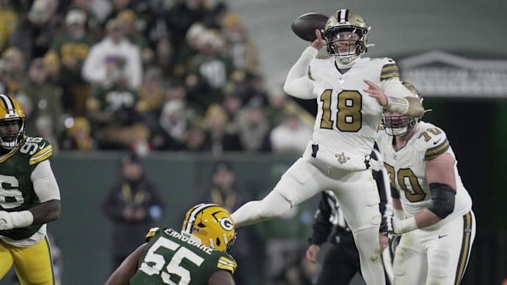 Dec 23, 2024; Green Bay, Wisconsin, USA; New Orleans Saints quarterback Spencer Rattler (18) is pressured by Green Bay Packers defensive end Kingsley Enagbare (55) during the third quarter at Lambeau Field. Mandatory Credit: Mark Hoffman/Milwaukee Journal Sentinel/Imagn Images Dec 23, 2024; Green Bay, Wisconsin, USA; New Orleans Saints quarterback Spencer Rattler (18) is pressured by Green Bay Packers defensive end Kingsley Enagbare (55) during the third quarter at Lambeau Field. Mandatory Credit: Mark Hoffman/Milwaukee Journal Sentinel/Imagn Images
