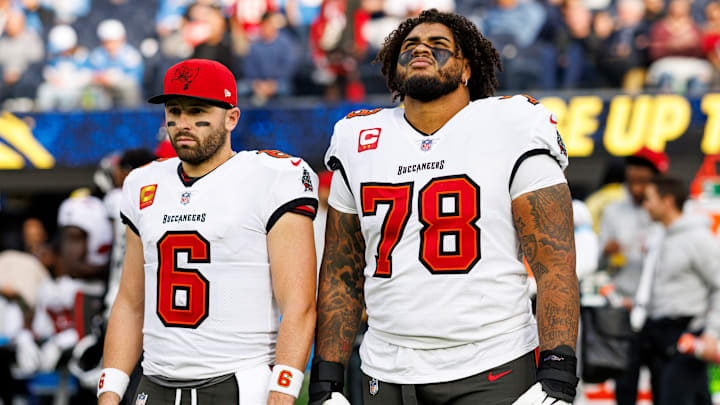 Baker Mayfield and his personal bodyguard, Tristan Wirfs