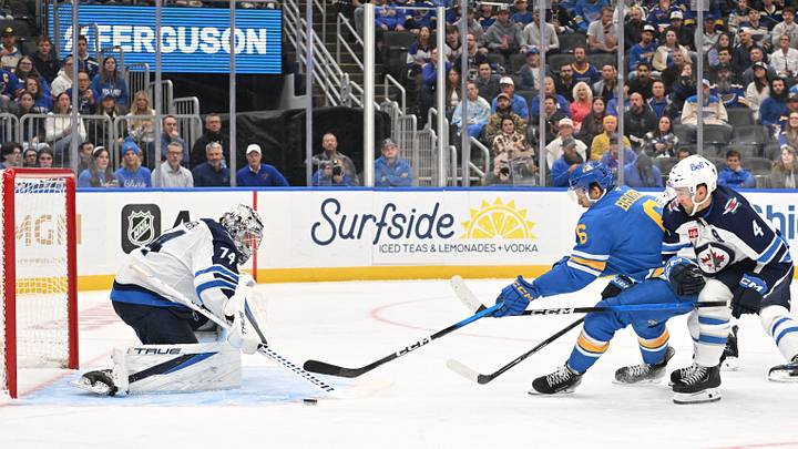 Oct 20, 2026; St. Louis, Missouri, USA;  Winnipeg Jets goaltender Stuart Skinner (74) and defenseman Neal Pionk (4) defend against St. Louis Blues defenseman Philip Broberg (6) during the second period at Enterprise Center.  Mandatory Credit: Jeff Le-Imagn Images