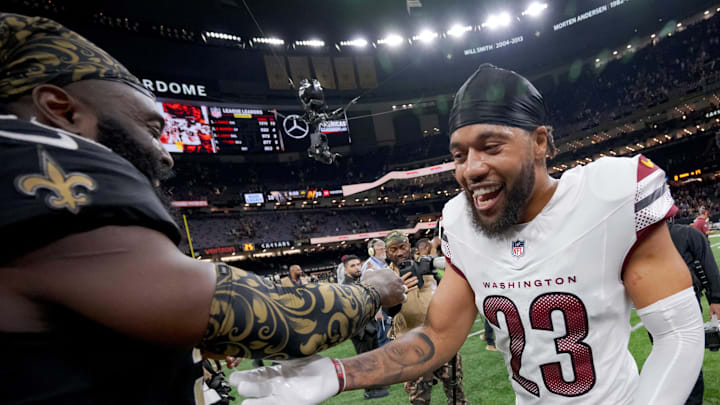 Dec 15, 2024; New Orleans, Louisiana, USA; New Orleans Saints linebacker Demario Davis (56) greets former teammate Washington Commanders cornerback Marshon Lattimore (23) at the end of the game at Caesars Superdome. Dec 15, 2024; New Orleans, Louisiana, USA; New Orleans Saints linebacker Demario Davis (56) greets former teammate Washington Commanders cornerback Marshon Lattimore (23) at the end of the game at Caesars Superdome.