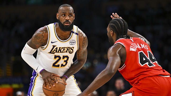 Los Angeles Lakers forward LeBron James is guarded by Chicago Bulls forward Patrick Williams.