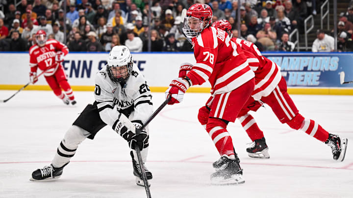 Apr 12, 2025; St. Louis, Missouri, UNITED STATES; Boston University Terriers defenseman Sascha Boumedienne (78) defends against Western Michigan Broncos forward Alex Bump (20) during the second period of the Frozen Four college ice hockey national championship at Enterprise Center. Mandatory Credit: Connor Hamilton-Imagn Images