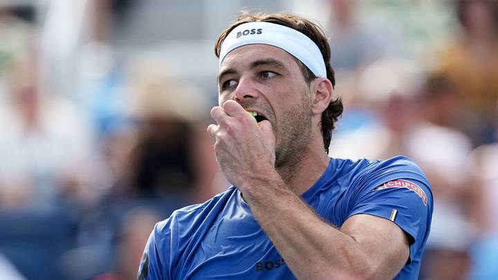 Aug 21, 2026; Mason, OH, USA; Taylor Fritz (USA) bites the tennis ball as he reacts after returning a shot against Ben Nakashima (USA) during the Cincinnati Open at Lindner Family Tennis Center. Mandatory Credit: Aaron Doster-Imagn Images Aug 21, 2026; Mason, OH, USA; Taylor Fritz (USA) bites the tennis ball as he reacts after returning a shot against Ben Nakashima (USA) during the Cincinnati Open at Lindner Family Tennis Center. Mandatory Credit: Aaron Doster-Imagn Images