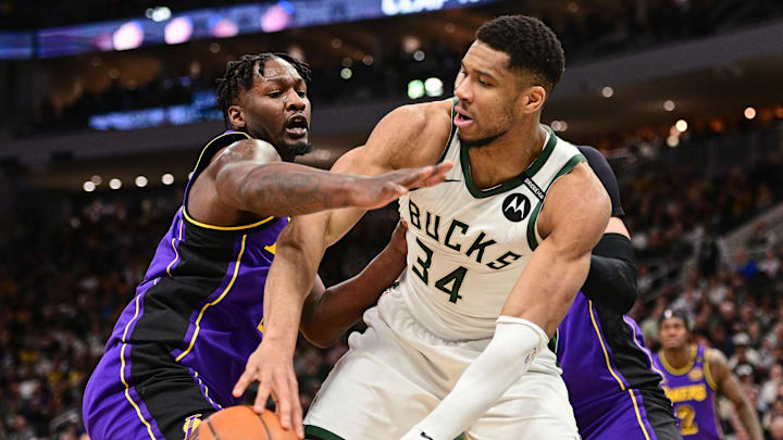 Mar 13, 2025; Milwaukee, Wisconsin, USA; Milwaukee Bucks forward Giannis Antetokounmpo (34) is defended by Los Angeles Lakers forward Dorian Finney-Smith (17) in the second quarter at Fiserv Forum. Mandatory Credit: Benny Sieu-Imagn Images Mar 13, 2025; Milwaukee, Wisconsin, USA; Milwaukee Bucks forward Giannis Antetokounmpo (34) is defended by Los Angeles Lakers forward Dorian Finney-Smith (17) in the second quarter at Fiserv Forum. Mandatory Credit: Benny Sieu-Imagn Images