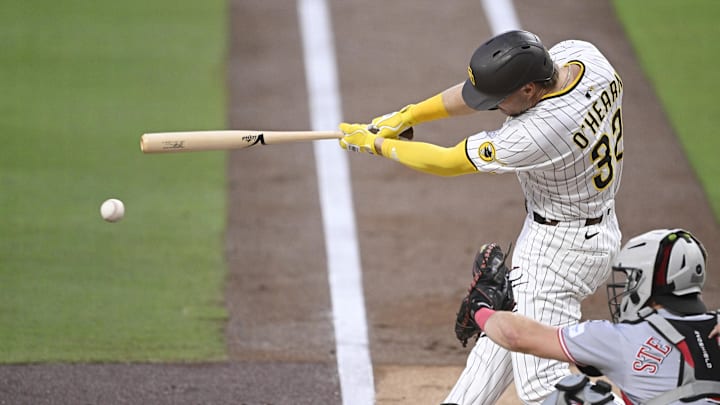 Sep 9, 2025; San Diego, California, USA; San Diego Padres first baseman Ryan O'Hearn (32) hits a single during the first inning against the Cincinnati Reds at Petco Park. Mandatory Credit: Denis Poroy-Imagn Images Sep 9, 2025; San Diego, California, USA; San Diego Padres first baseman Ryan O'Hearn (32) hits a single during the first inning against the Cincinnati Reds at Petco Park. Mandatory Credit: Denis Poroy-Imagn Images