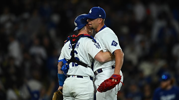 Mar 29, 2025; Los Angeles, California, USA; Los Angeles Dodgers pitcher Blake Treinen (49) celebrates with catcher Will Smith (16) after defeating the Detroit Tigers at Dodger Stadium. Mandatory Credit: Jonathan Hui-Imagn Images
