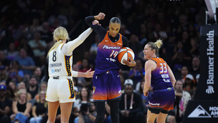 Fever guard Sophie Cunningham fouls Mercury guard DeWanna Bonner (14) during a game at PHX Arena in Phoenix on Aug. 7, 2025. Fever guard Sophie Cunningham fouls Mercury guard DeWanna Bonner (14) during a game at PHX Arena in Phoenix on Aug. 7, 2025.
