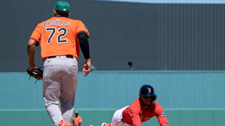 Boston Red Sox Ceddane Rafaela (3) slides back into first base trying to avoid the tag by Baltimore Orioles Samuel Basallo (72) at JetBlue Park at Fenway South on March 17.