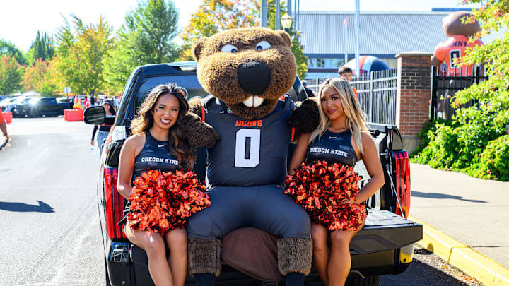 Sep 21, 2024; Corvallis, Oregon, USA; Oregon State Beavers cheerleaders pose with Benny the mascot before the game against the Purdue Boilermakers at Reser Stadium. Mandatory Credit: Craig Strobeck-Imagn Images