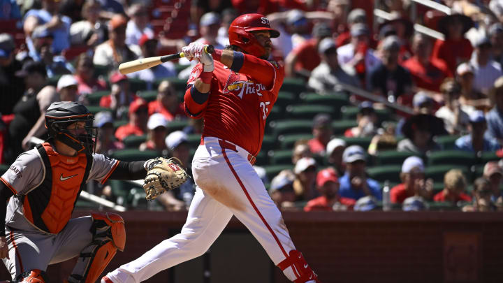 Jun 23, 2024; St. Louis, Missouri, USA; St. Louis Cardinals third baseman Brandon Crawford (35) hits a RBI double in the eighth inning against the San Francisco Giants at Busch Stadium. Mandatory Credit: Joe Puetz-USA TODAY Sports