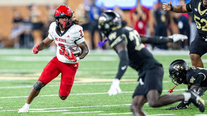 Sep 11, 2025; Winston-Salem, North Carolina, USA; North Carolina State Wolfpack running back Hollywood Smothers (3) runs the ball in the first half against the Wake Forest Demon Deacons at Allegacy Federal Credit Union Stadium. Mandatory Credit: Luke Jamroz-Imagn Images Sep 11, 2025; Winston-Salem, North Carolina, USA; North Carolina State Wolfpack running back Hollywood Smothers (3) runs the ball in the first half against the Wake Forest Demon Deacons at Allegacy Federal Credit Union Stadium. Mandatory Credit: Luke Jamroz-Imagn Images
