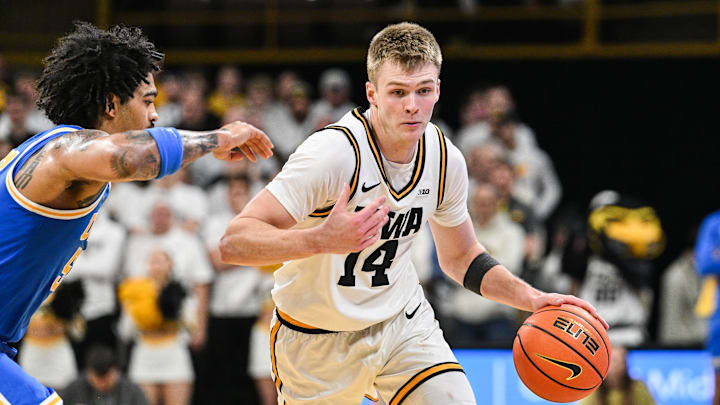 Jan 3, 2026; Iowa City, Iowa, USA; Iowa Hawkeyes guard Bennett Stirtz (14) controls the ball as UCLA Bruins guard Skyy Clark (55) defends during the second half at Carver-Hawkeye Arena. Mandatory Credit: Jeffrey Becker-Imagn Images Jan 3, 2026; Iowa City, Iowa, USA; Iowa Hawkeyes guard Bennett Stirtz (14) controls the ball as UCLA Bruins guard Skyy Clark (55) defends during the second half at Carver-Hawkeye Arena. Mandatory Credit: Jeffrey Becker-Imagn Images