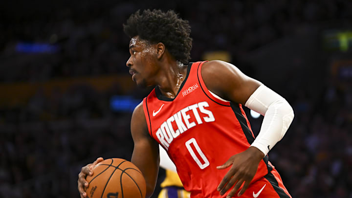 Apr 11, 2025; Los Angeles, California, USA; Houston Rockets guard Aaron Holiday (0) moves the ball against the Los Angeles Lakers during the first half at Crypto.com Arena. Mandatory Credit: Jonathan Hui-Imagn Images