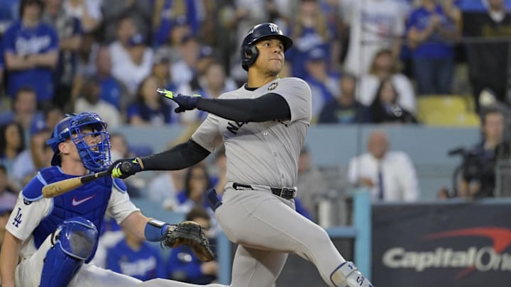 Oct 26, 2024; Los Angeles, California, USA; New York Yankees outfielder Juan Soto (22) hits a solo home run in the third inning against the Los Angeles Dodgers during game two of the 2024 MLB World Series at Dodger Stadium. Mandatory Credit: Jayne Kamin-Oncea-Imagn Images