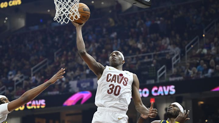 Apr 13, 2025; Cleveland, Ohio, USA; Cleveland Cavaliers forward Nae'Qwan Tomlin (30) drives to the basket beside Indiana Pacers forward Jarace Walker (5) in the first quarter at Rocket Arena. Mandatory Credit: David Richard-Imagn Images